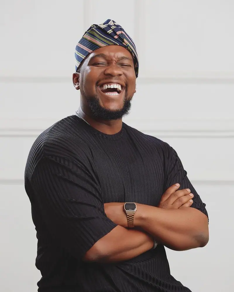 IniOluwa Karunwi laughing, arms crossed
